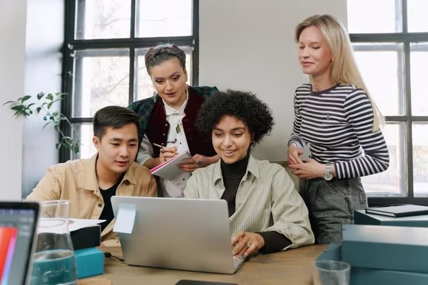 [Visual] stock image group at computer