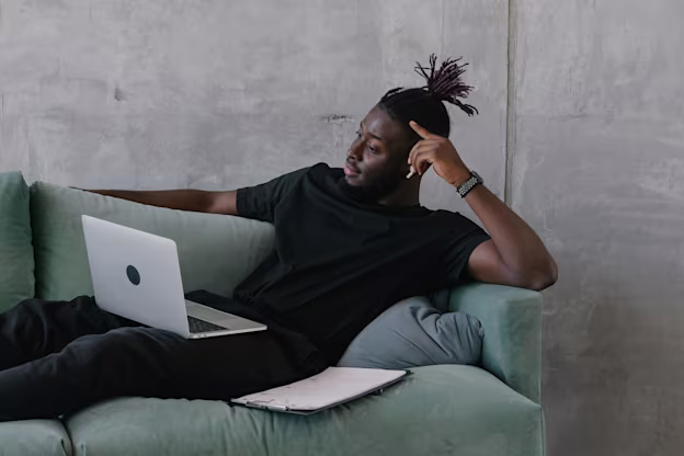 [visual] Man working from sofa