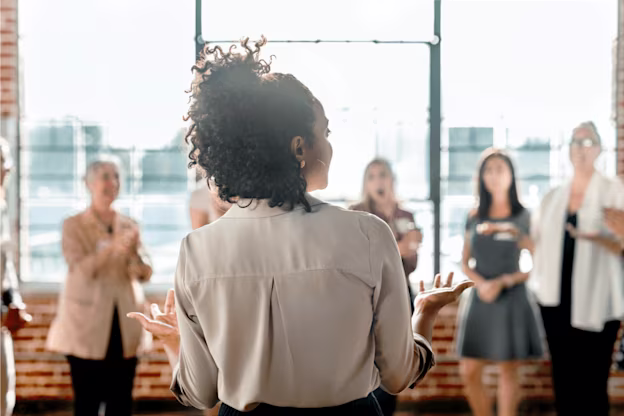[visual] Woman speaking to colleagues