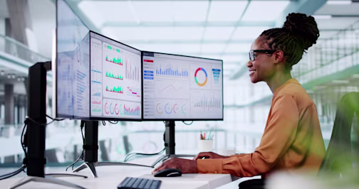 [Visual] stock woman with 2 computer screens 