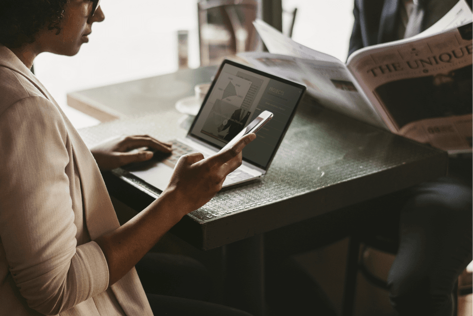 Person browsing comparison websites on a laptop, representing the research phase of the customer journey.