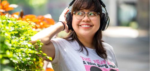 Woman listening to music on headphones