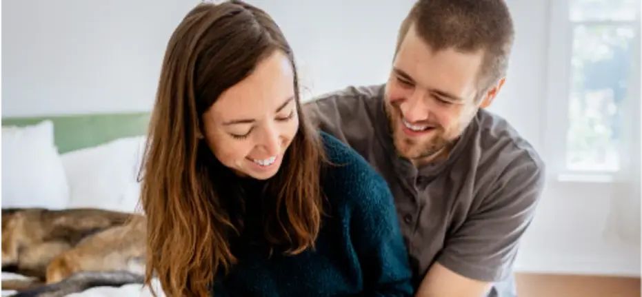 Man and a woman laughing together