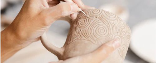 Person doing pottery