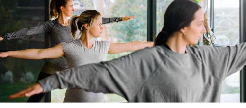 Three people doing yoga exercises
