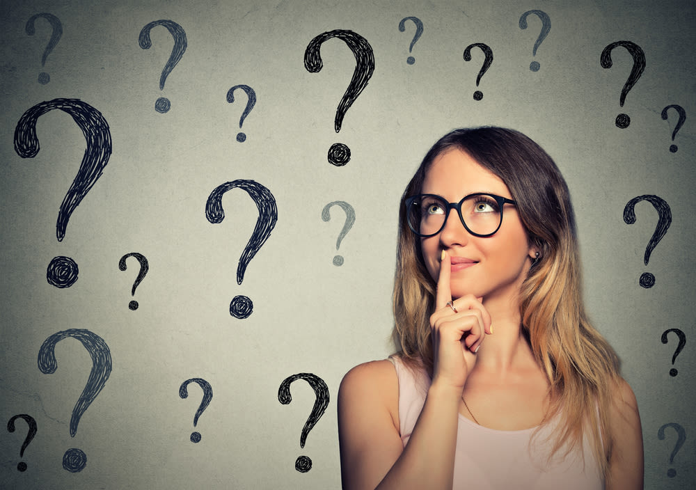 Thinking woman with glasses