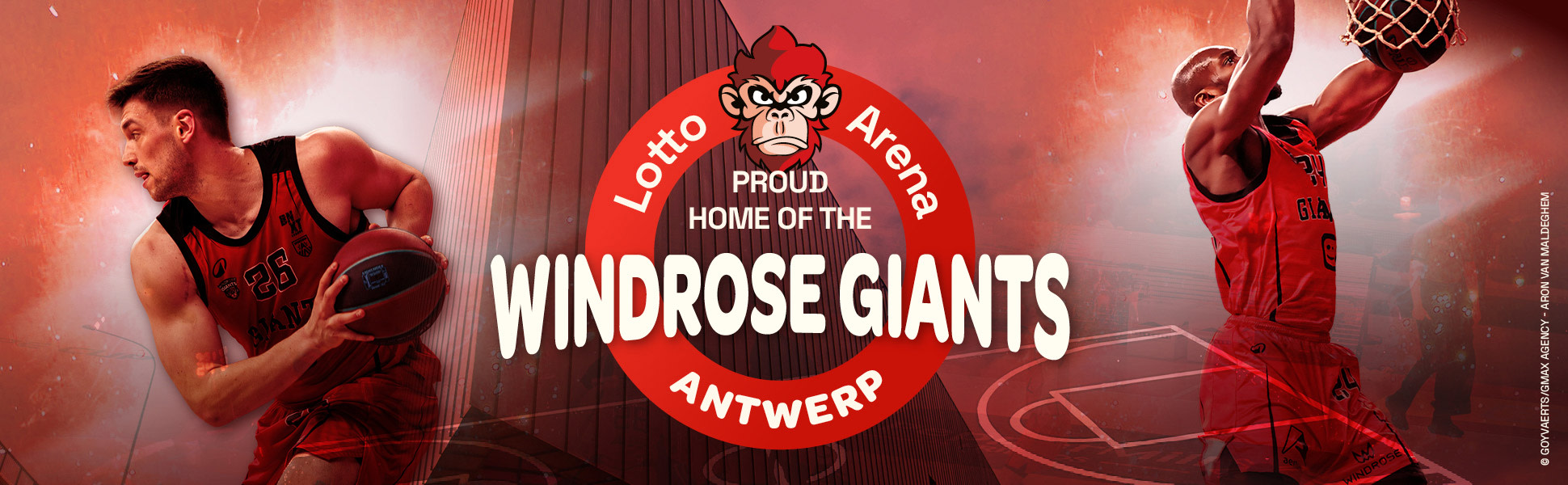Banner van Lotto Arena Antwerpen als trotse thuisbasis van de Windrose Giants. Links en rechts staan basketbalspelers in actie, met centraal het logo en de tekst “Proud Home of the Windrose Giants”.