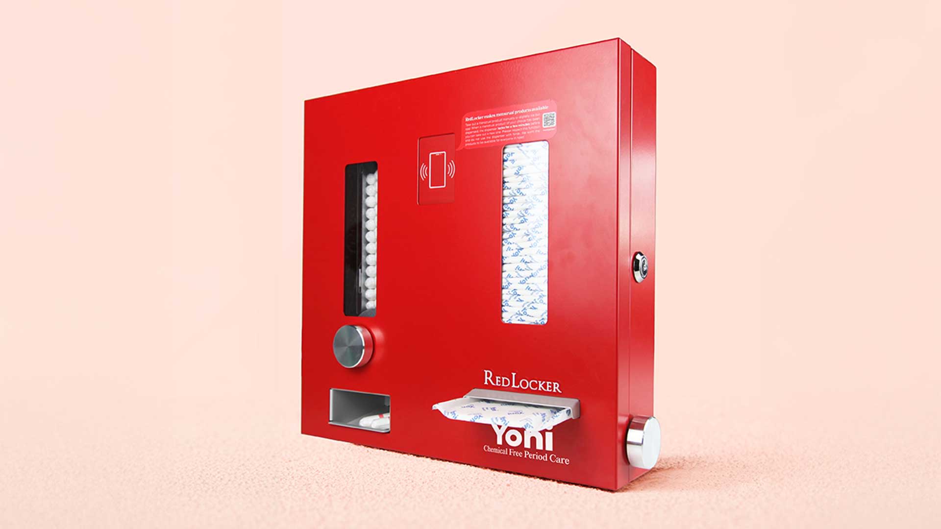 Rode automaat met transparante vensters waarin tampons en maandverband zichtbaar zijn. Op de voorkant staat 'RedLocker' en 'Yoni Chemical Free Period Care'. De automaat heeft een gleuf voor uitgifte en een ronde knop.