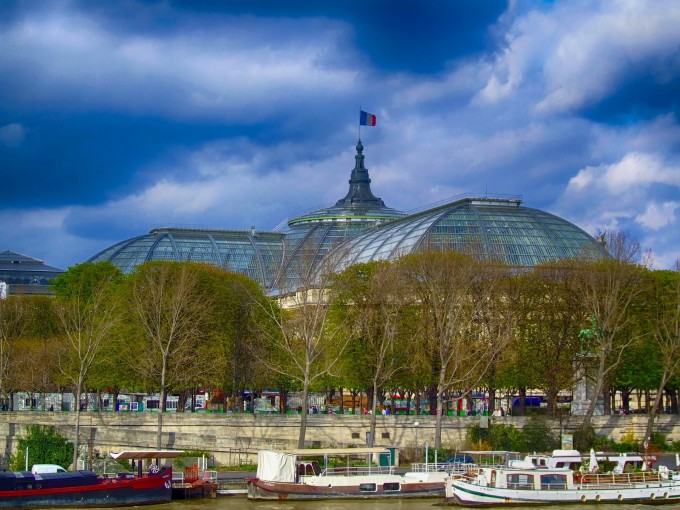 View of Galeries nationales du grand palais, Paris with boats on the Seine