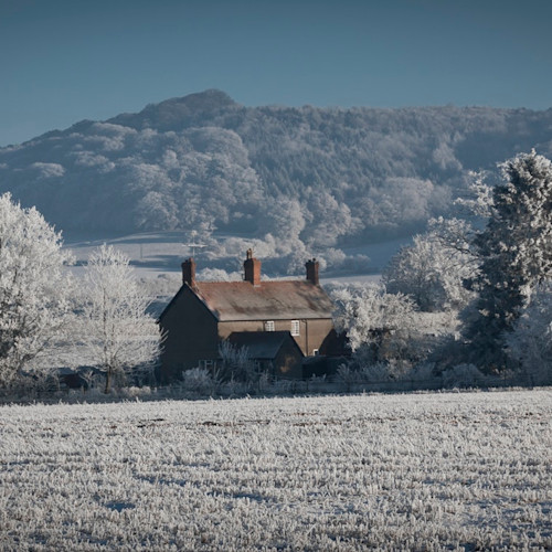 A country cottage in an English landscape