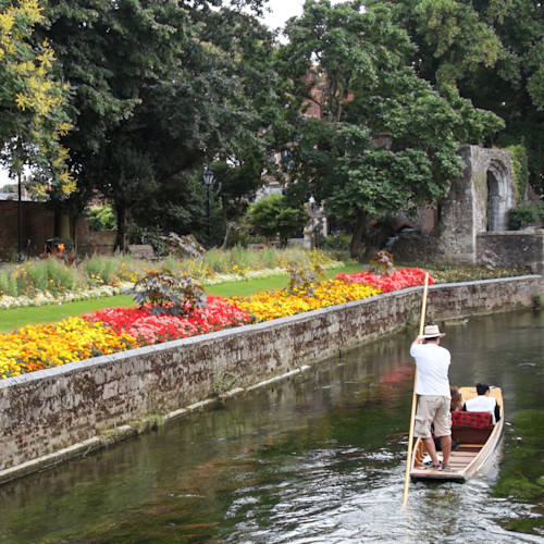 A boat punts up a river in Kent