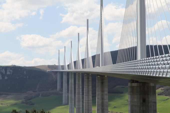 Daytime view of Viaduc de millau with hills beyond