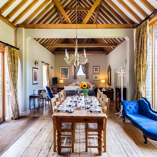 self catering cottage living room with set table