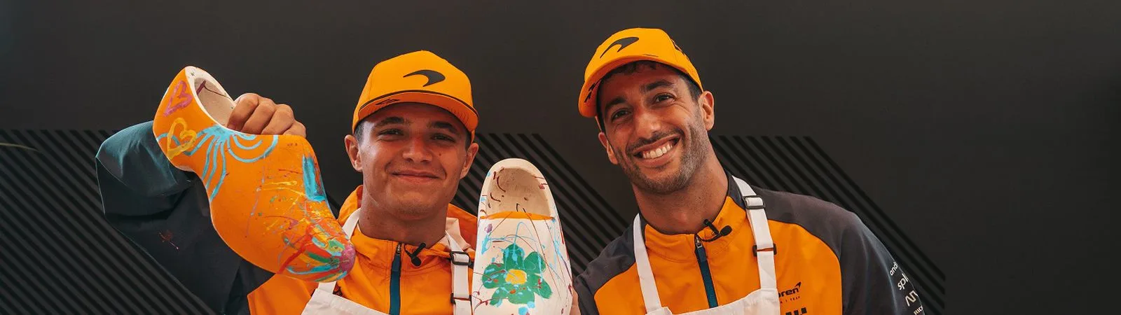 McLaren Formula 1 drivers Lando Norris and Daniel Ricciardo paint clogs at the Dutch Grand Prix in Zandvoort