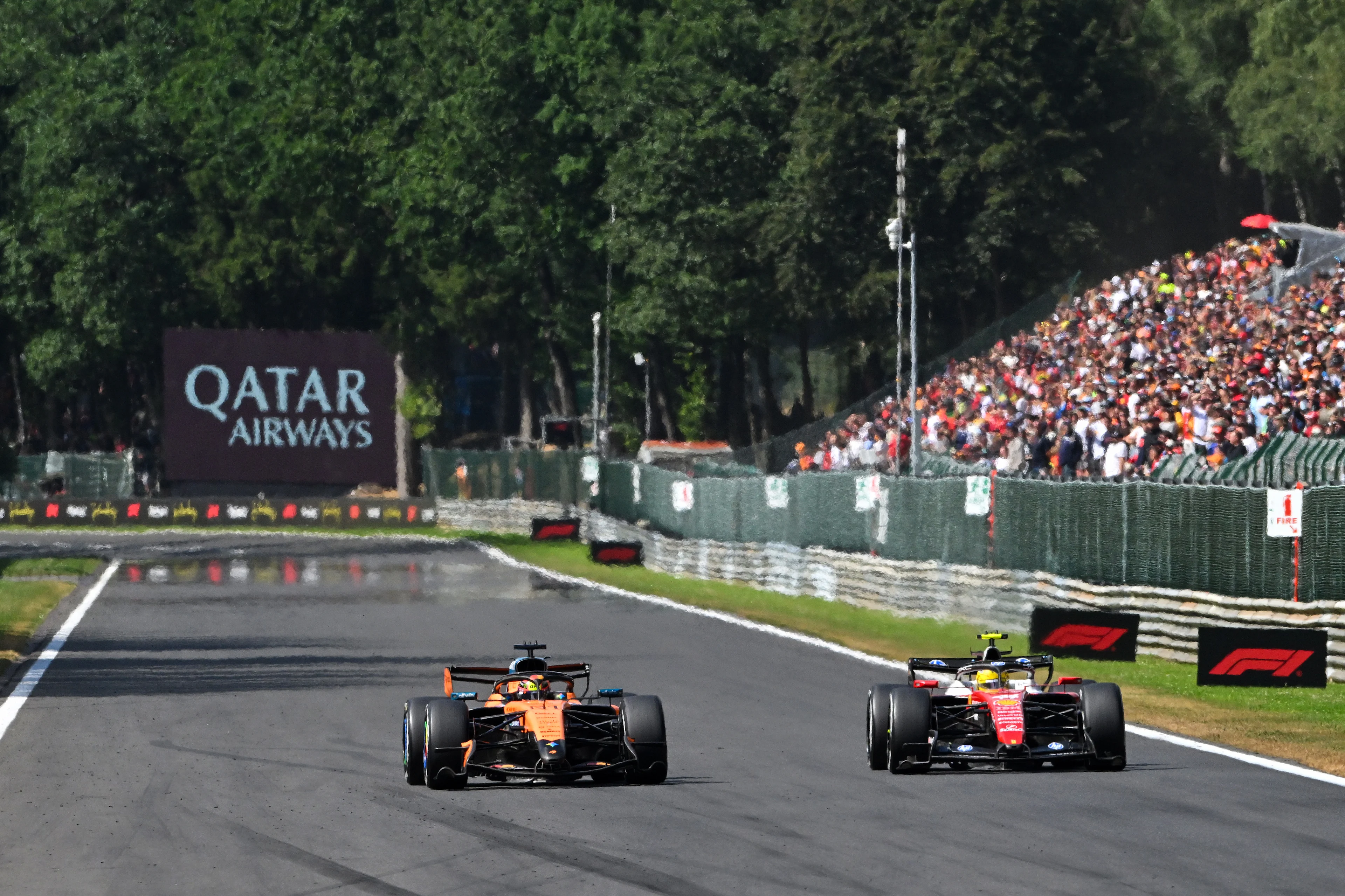 Lewis Hamilton and Oscar Piastri battle for track position at Spa