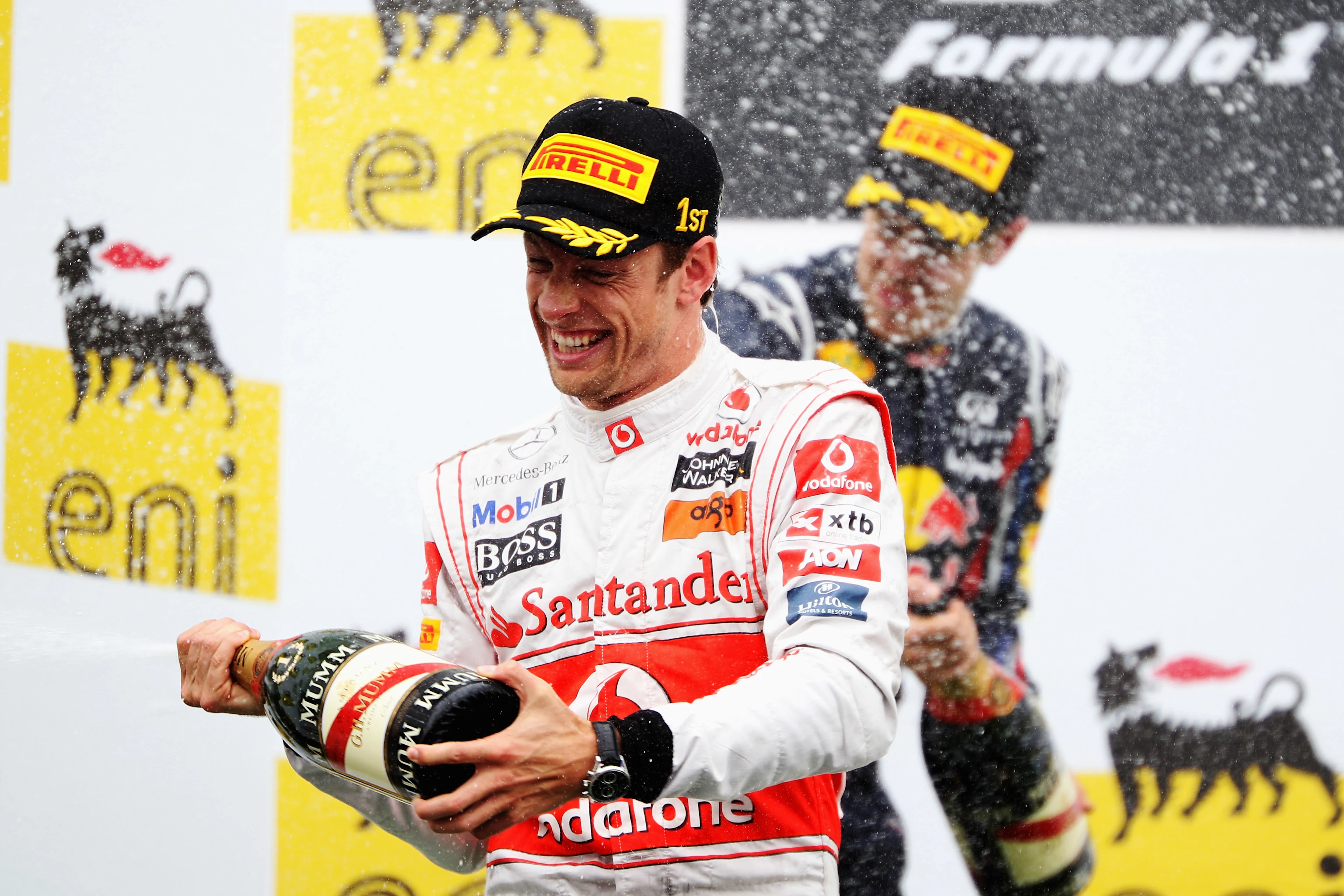 Jenson Button celebrates on the podium after winning his 200th Grand Prix during the Hungarian Grand Prix at the Hungaroring