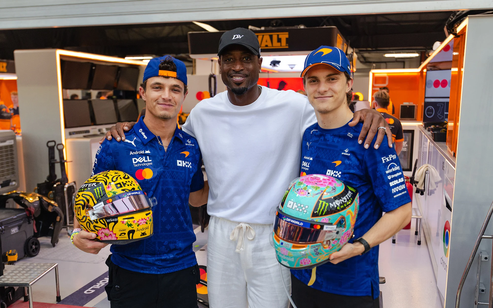 Lando Norris and Oscar Piastri with Dwyane Wade at the McLaren garage at the Singapore Grand Prix