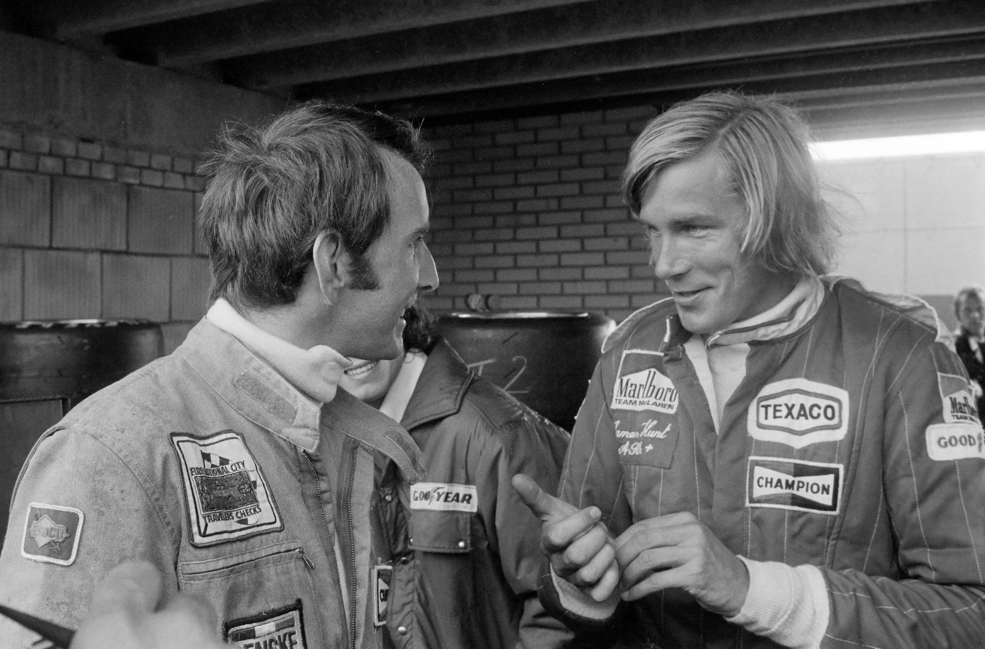 James Hunt at the Dutch Grand Prix in 1976 with John Watson (L), his friend, rival, and successor at McLaren