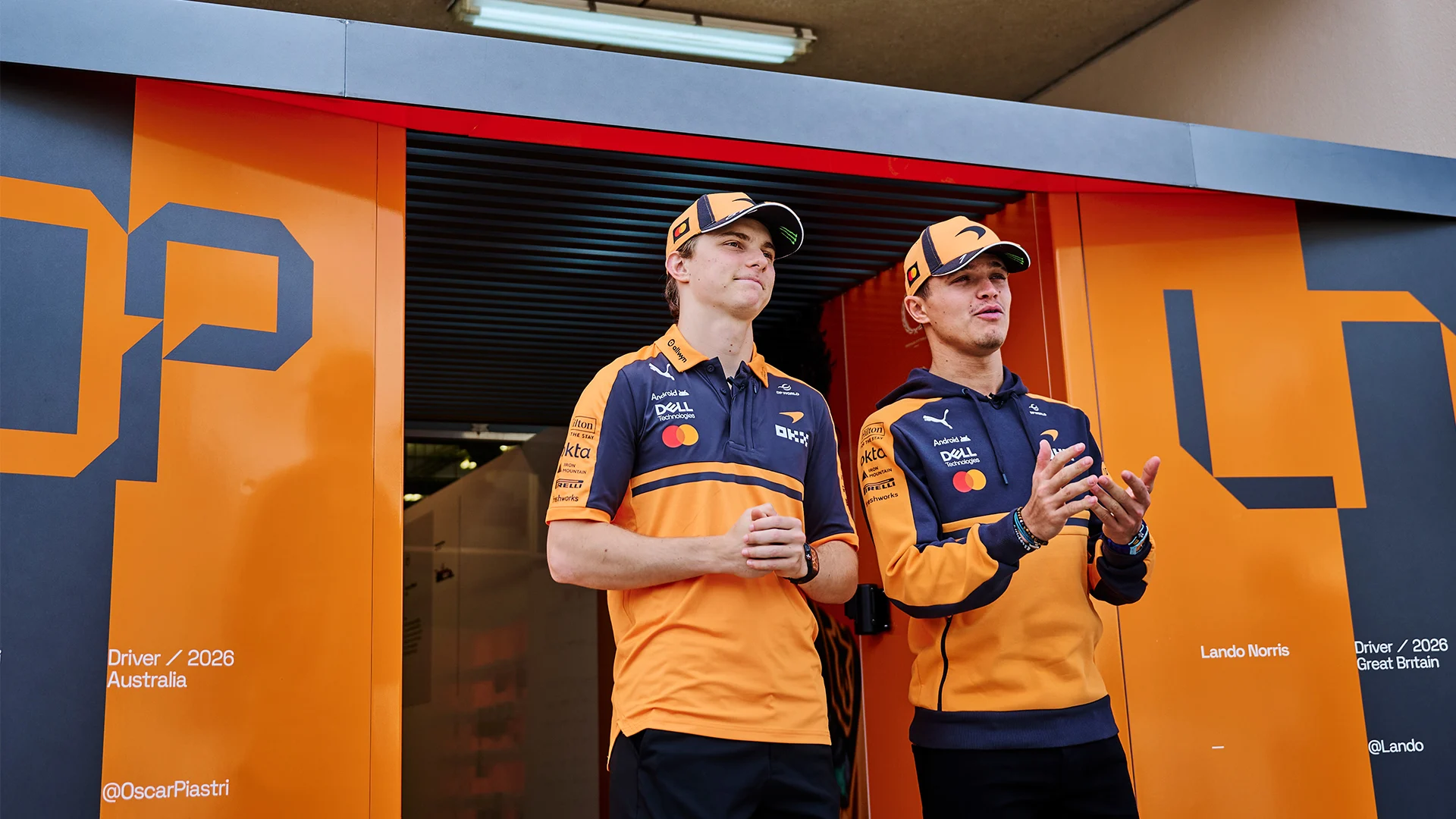 Lando and Oscar outside the garage