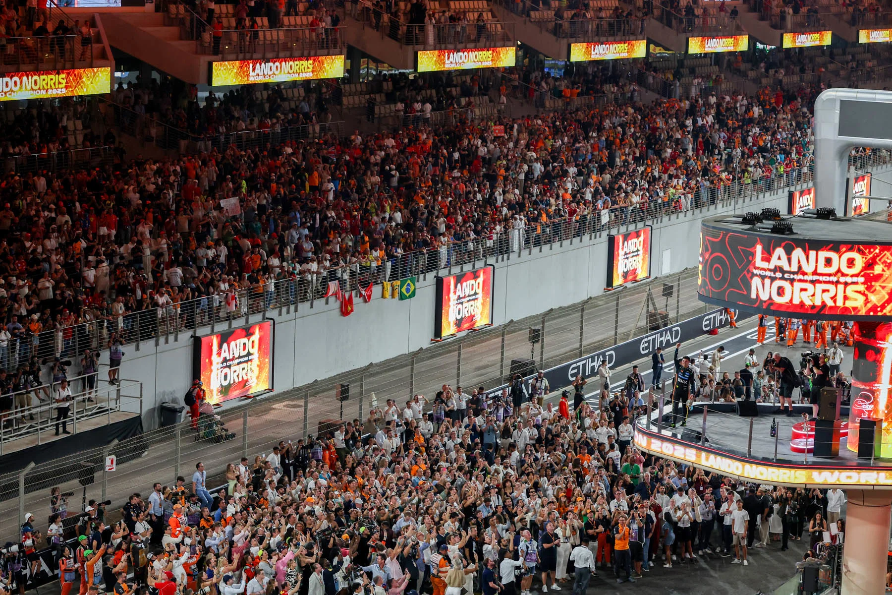 Lewis Hamilton and Carlos Sainz were among those in the paddock to congratulate Lando on his Championship success