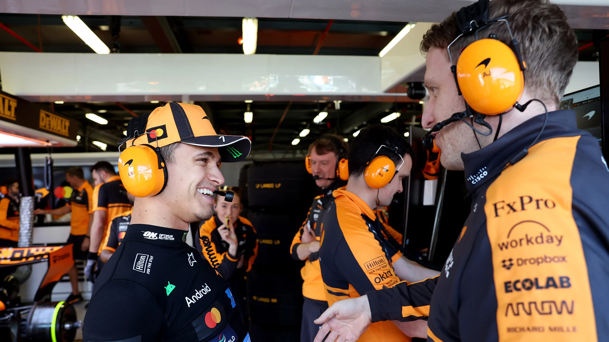 Lando Norris and McLaren talks in the garage prior to final practice ahead of the F1 Grand Prix of Australia at Albert Park Grand Prix Circuit 
