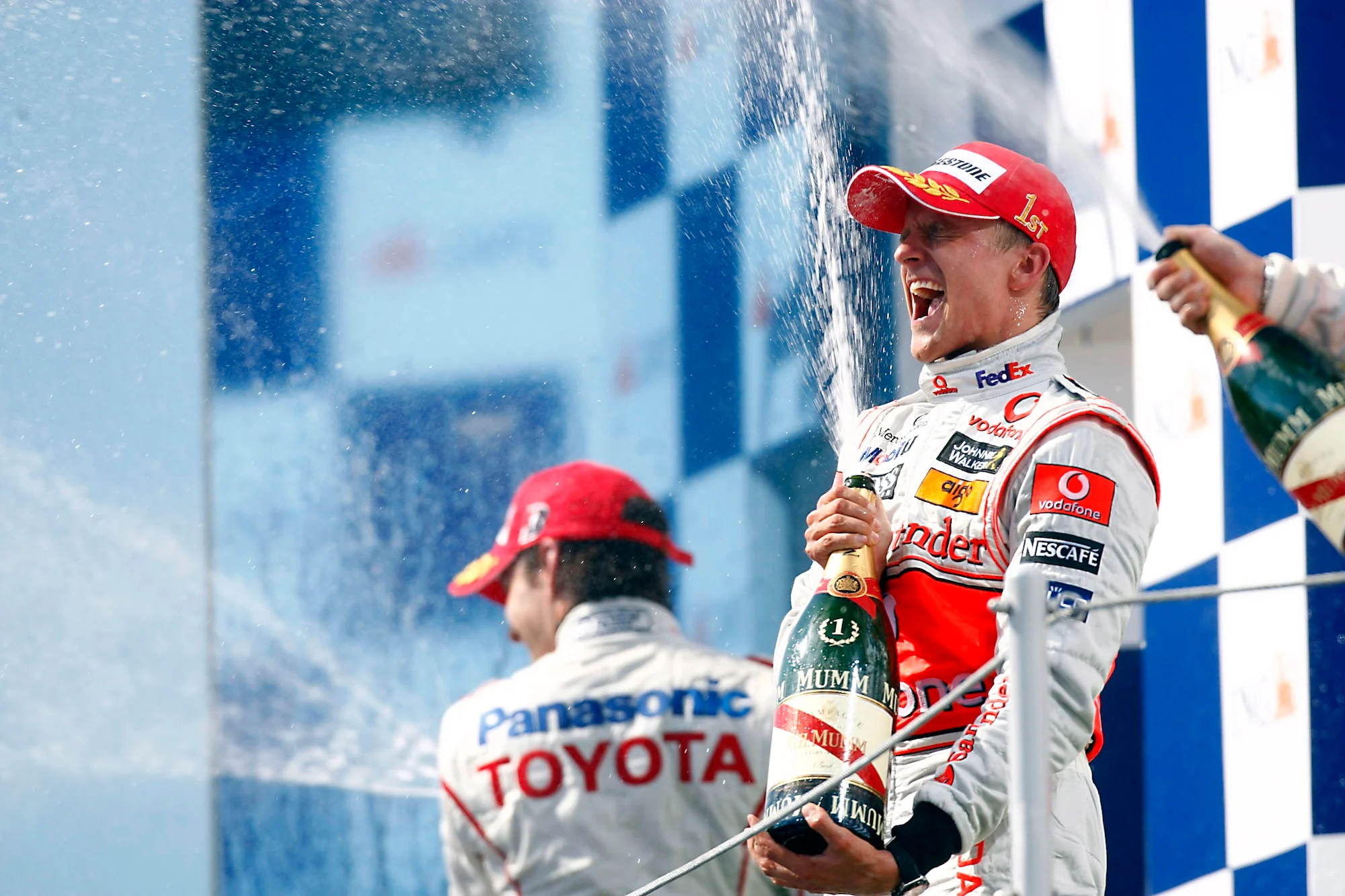 Heikki Kovalainen celebrating his win at the Hungaroring with McLaren in 2008