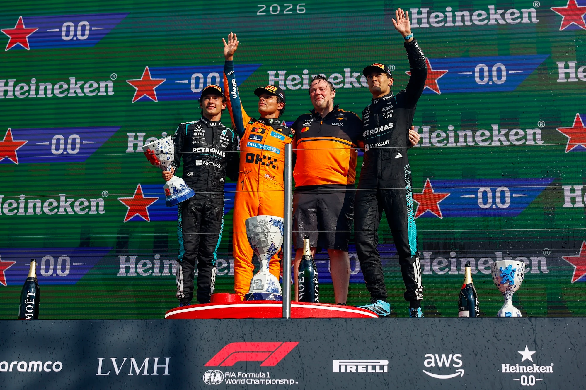 Race winner Lando Norris and Second placed Andrea Kimi Antonelli and Third placed George Russell on the podium during the Zandvoort grand prix