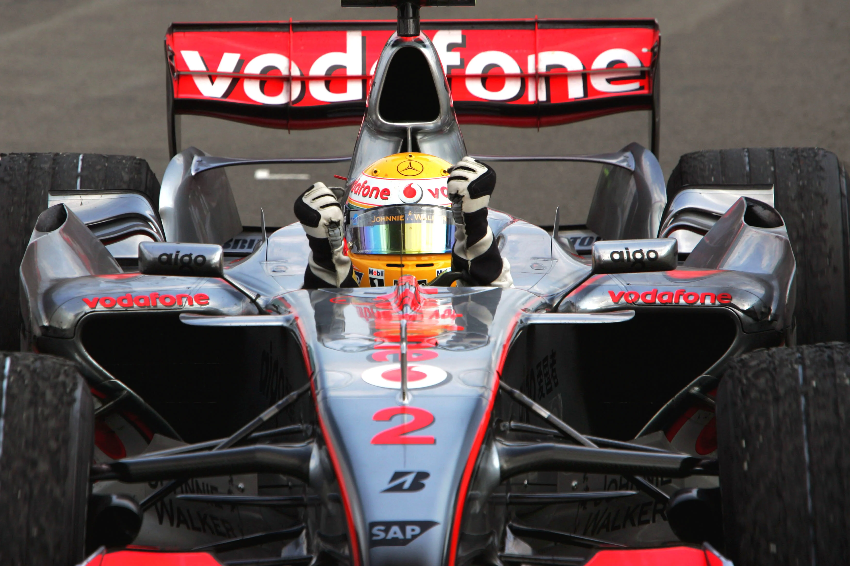 Lewis Hamilton and McLaren celebrates on the podium after winning the Hungarian Grand Prix in 2012