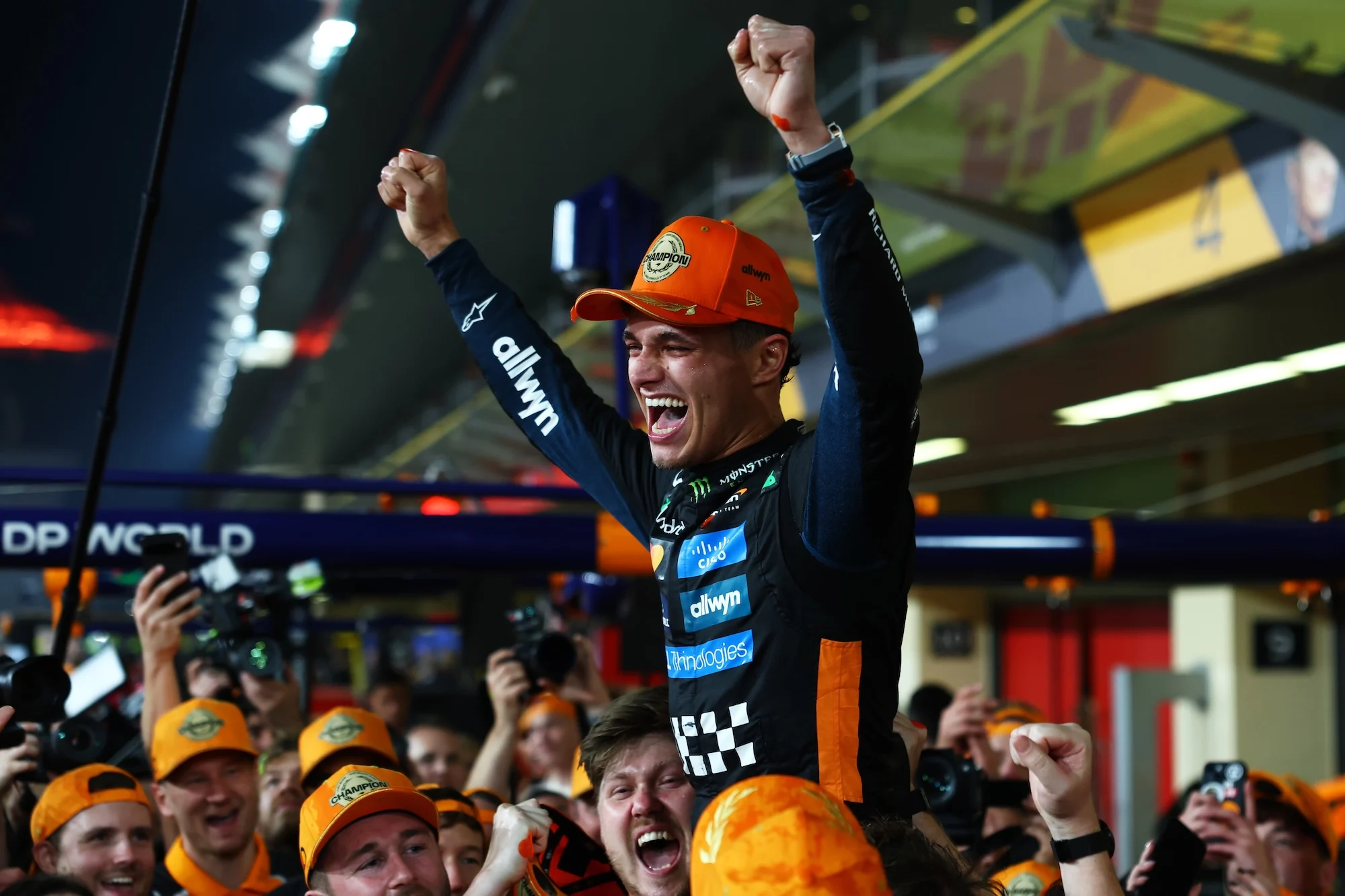 2025 F1 World Drivers Champion Lando Norris and McLaren celebrates with his team during the F1 Grand Prix of Abu Dhabi at Yas Marina Circuit