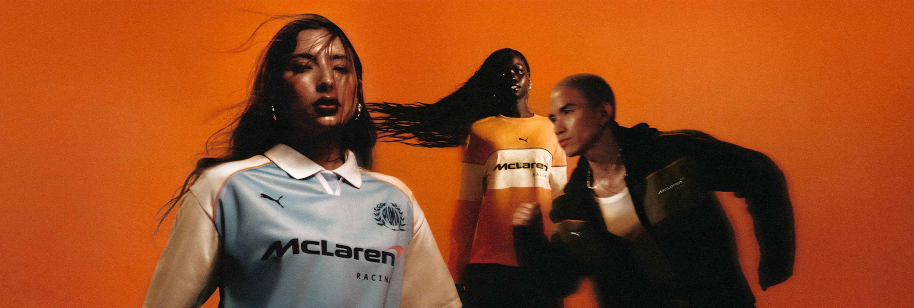 A group of McLaren fans showing off their McLaren merchandise