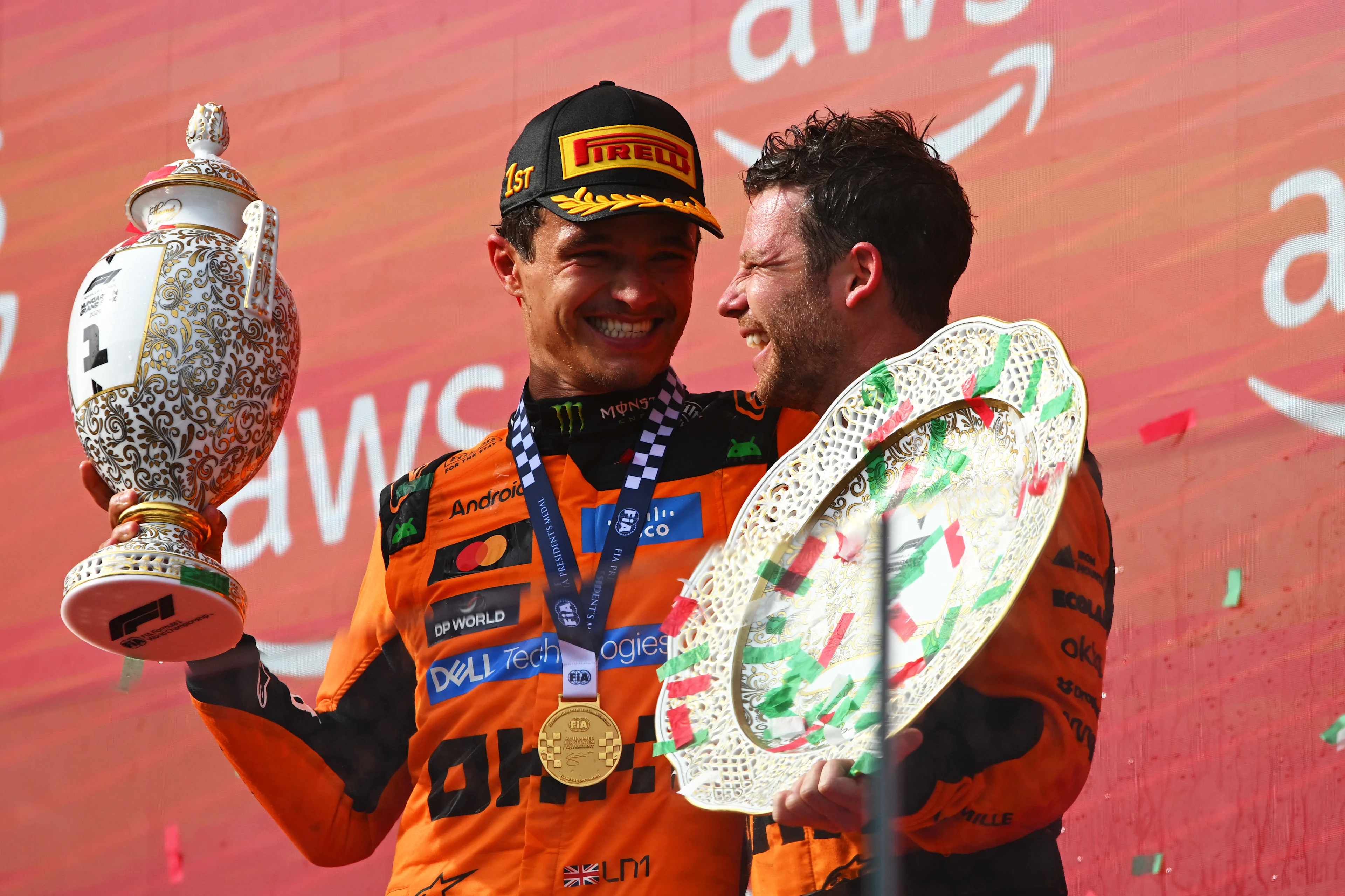 Race winner Lando Norris and McLaren celebrate on the podium with the trophies during the F1 Grand Prix of Hungary