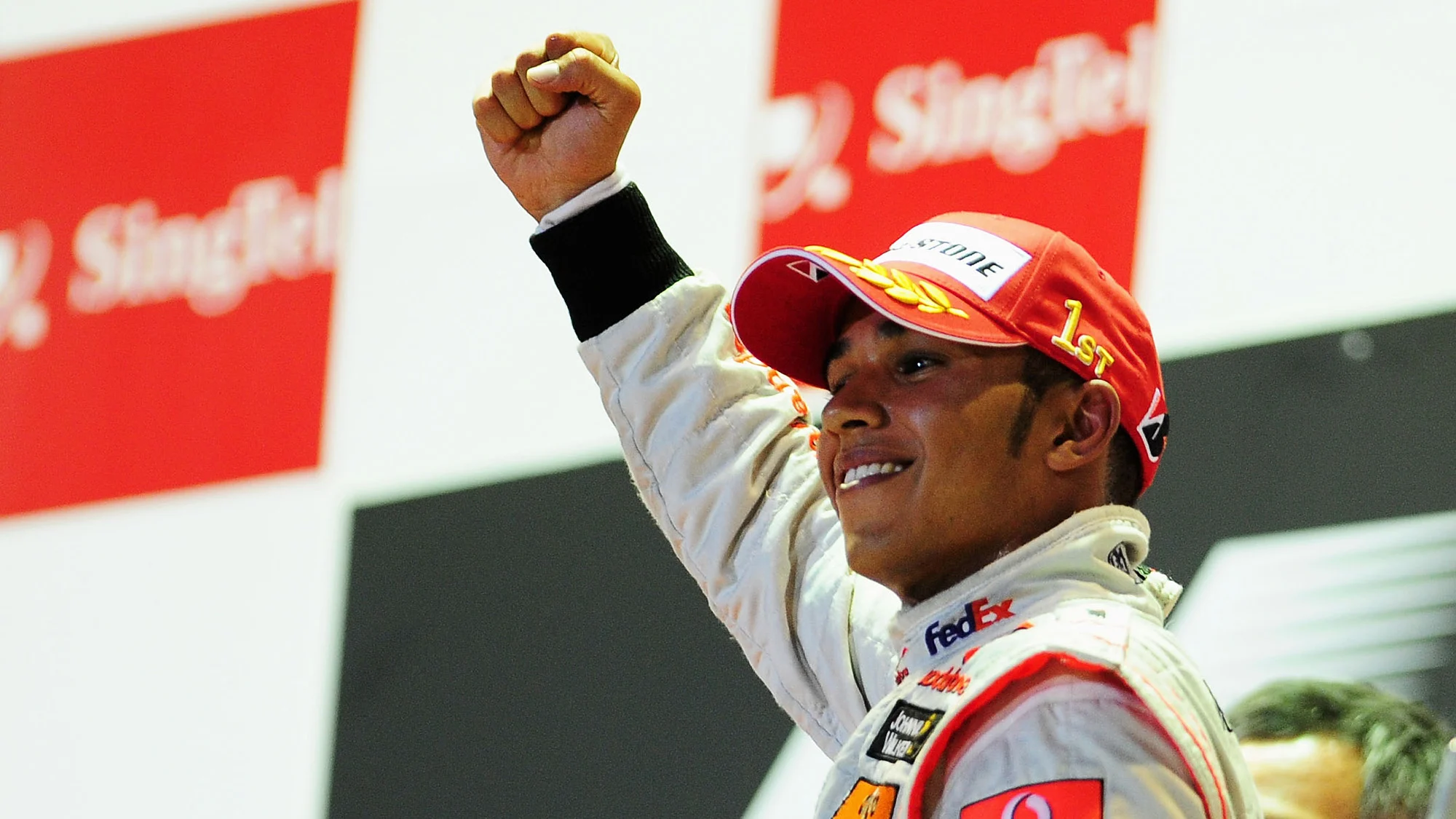  Lewis Hamilton and McLaren celebrates on the podium after winning the Singapore Formula One Grand Prix at the Marina Bay Street Circuit on September 27, 2009 in Singapore. 