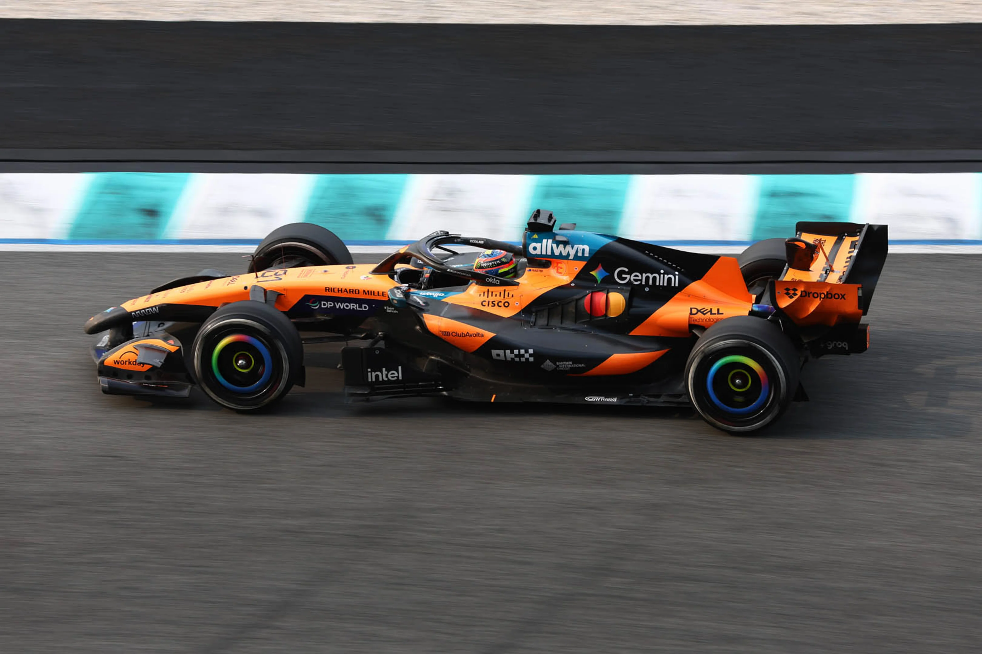 Oscar Piastri and Lando Norris competing on track in their McLaren Formula 1 cars