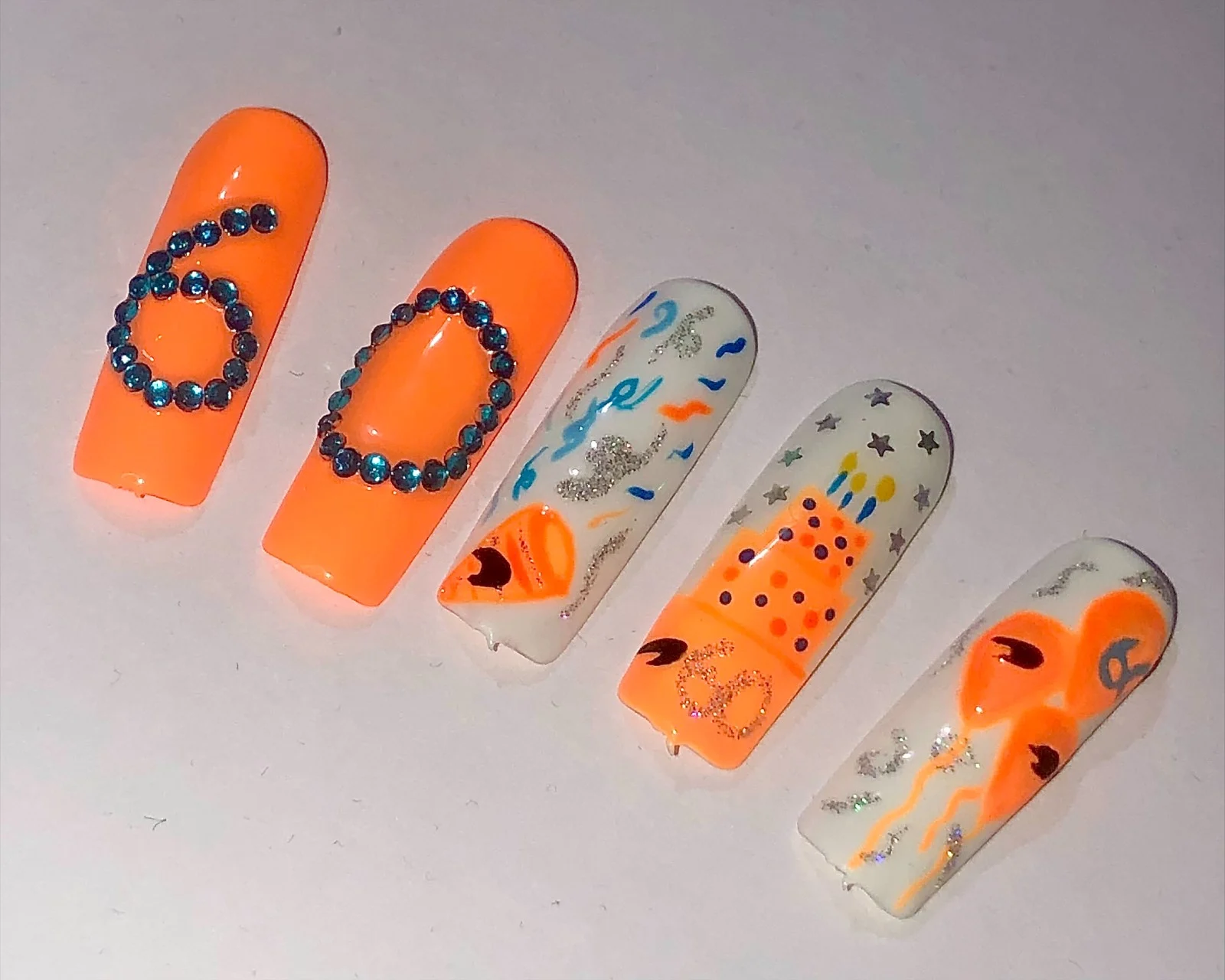 Formula-1 - 2024 - Meet-the-mclaren-fans-who-do-whatever-it-takes-to-support-the-team - Incredible McLaren nail art - 1