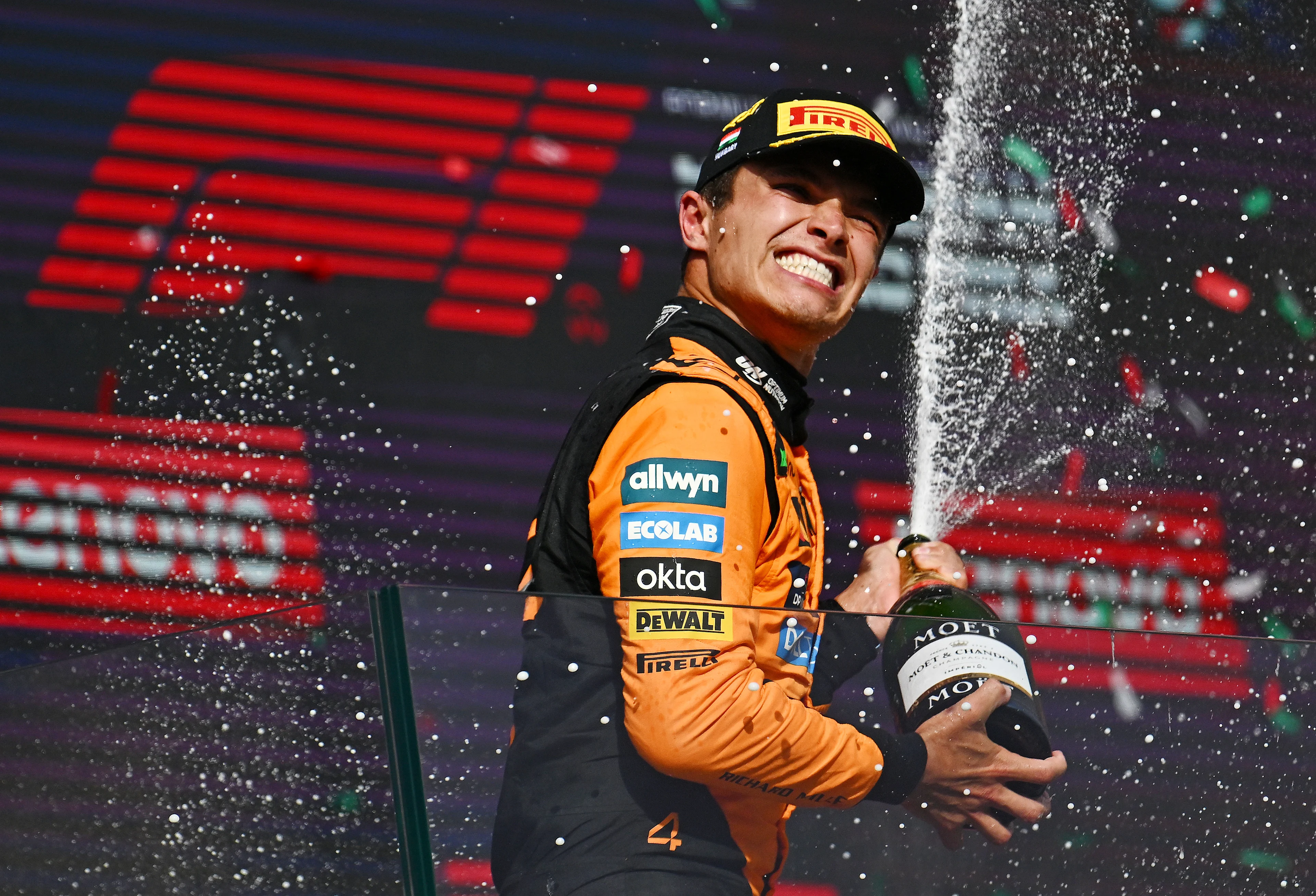 Race winner Lando Norris sprays the victory Champagne on the podium during the F1 Grand Prix of Hungary at Hungaroring