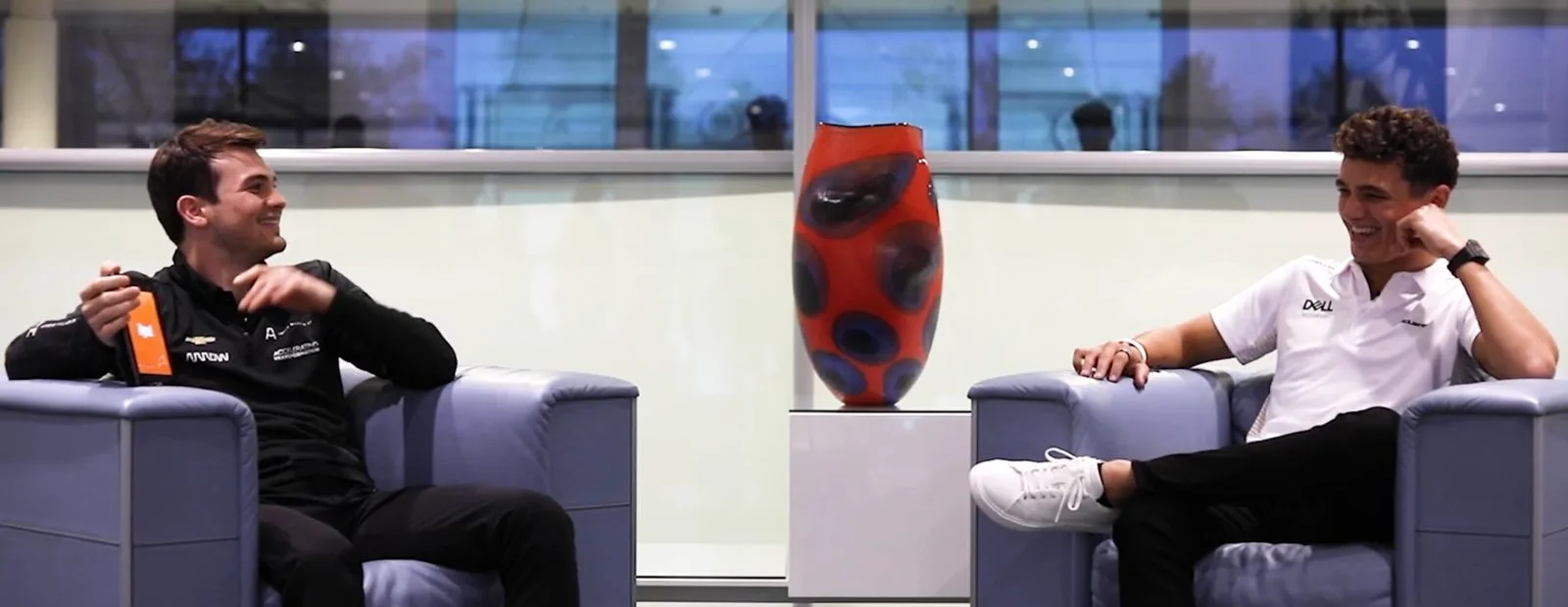 Arrow McLaren SP driver Pato O'Ward gives McLaren F1 driver Lando Norris some Spanish lessons.