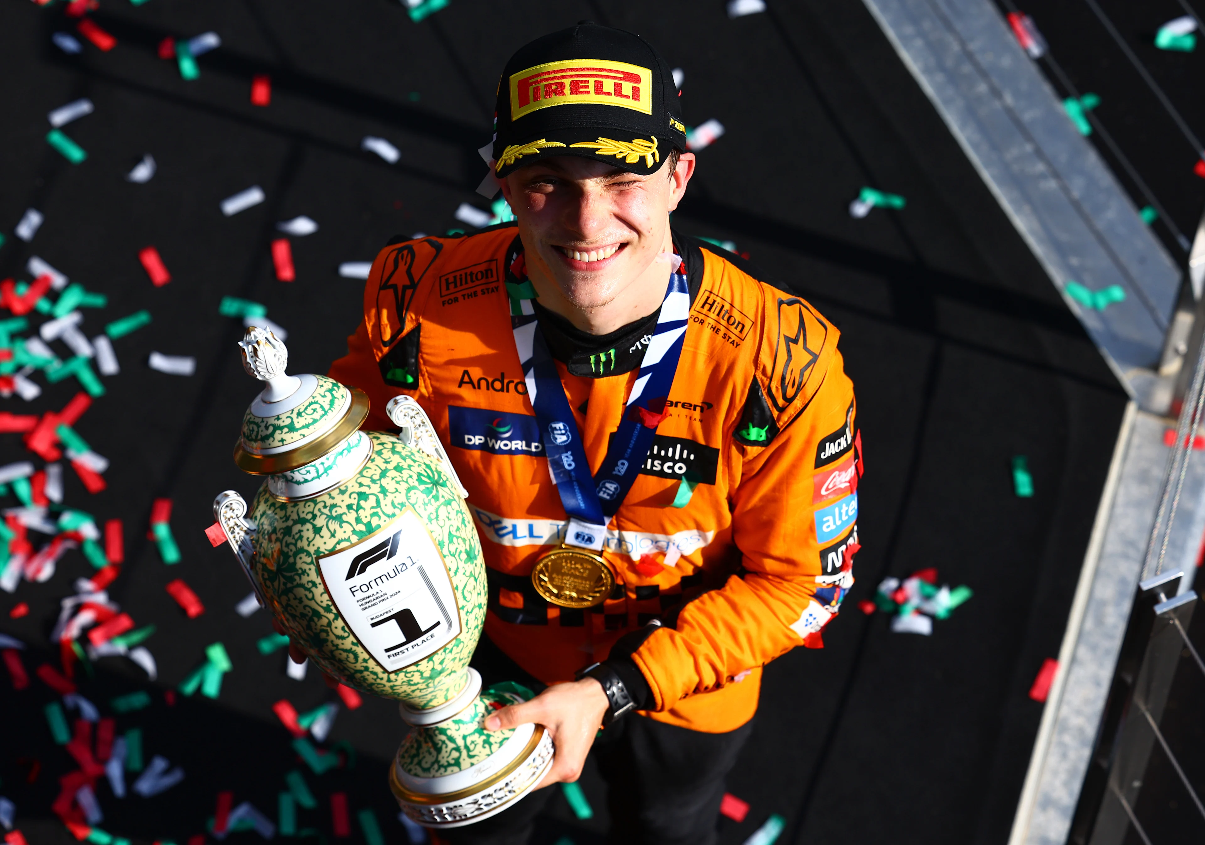 Race winner Oscar Piastri celebrates his maiden race win on the podium in Hungary