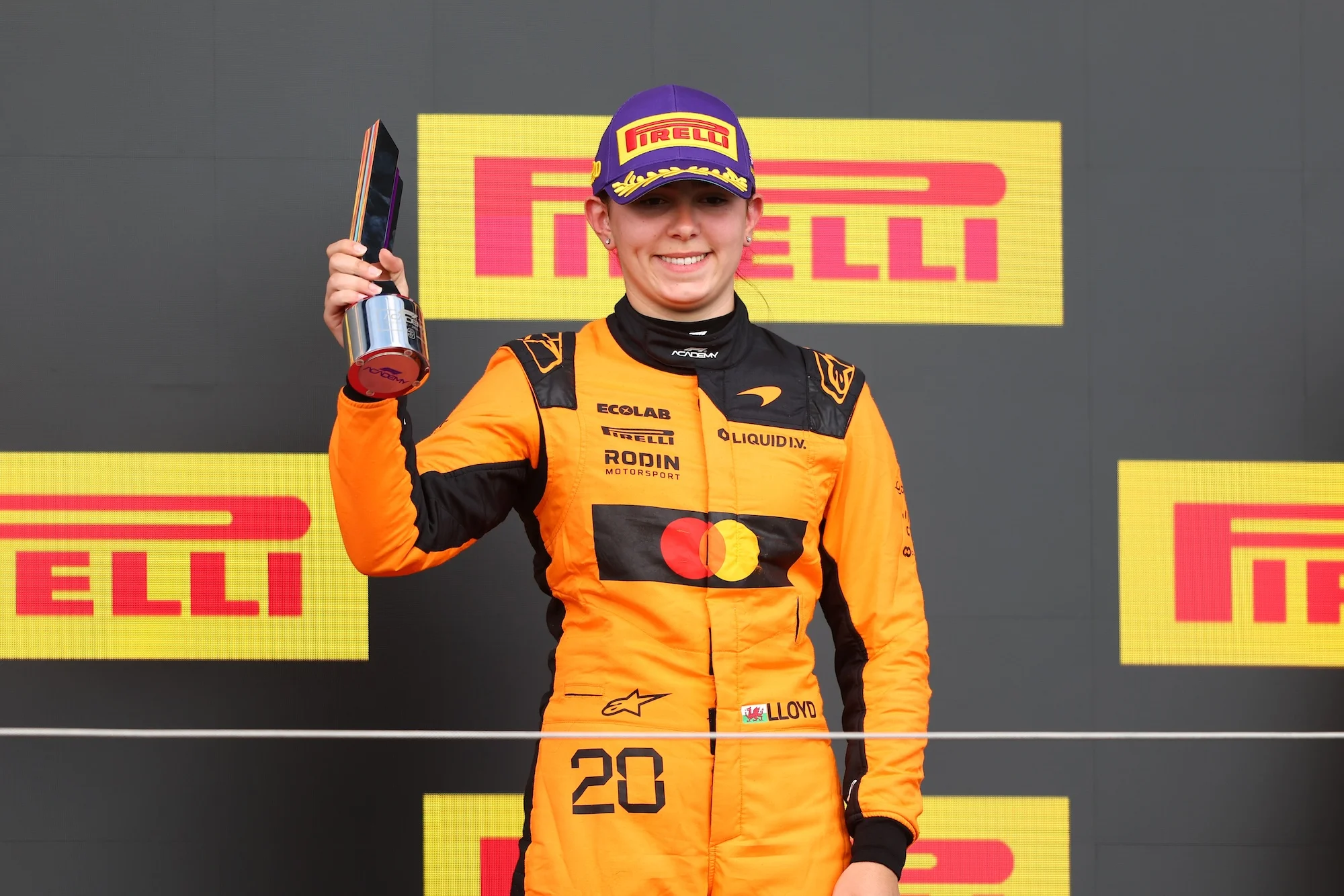 Ella Lloyd celebrates thrid place on the podium during F1 Academy Round 3, race 1 at Silverstone Circuit