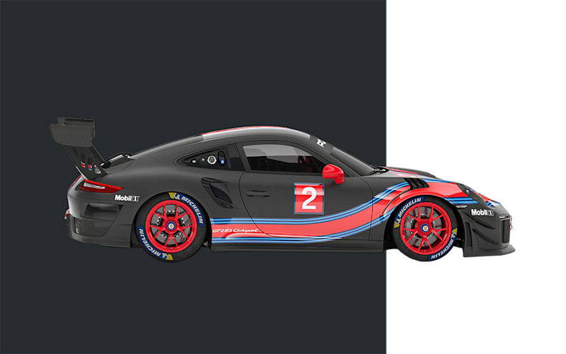 Schwarzer und roter Porsche Rennwagen mit blauen Akzenten und Nummer 2 an der Seite, mit auffälligem Heckflügel.