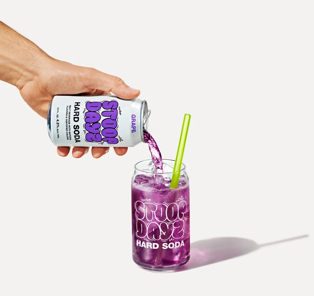 Grape Stoop Dayz Hard Soda being poured into a glass