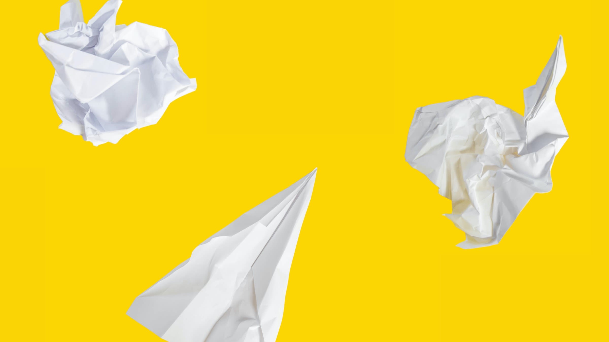 This image shows paper planes in various states of crumpling. It is intended to illustrate the article "Email Sending with AWS SES: A Comprehensive Guide".