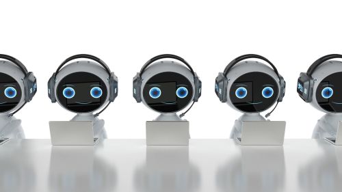 This image shows several small robots sitting in front of laptops. It is meant to symbolize the automation of email communication. 