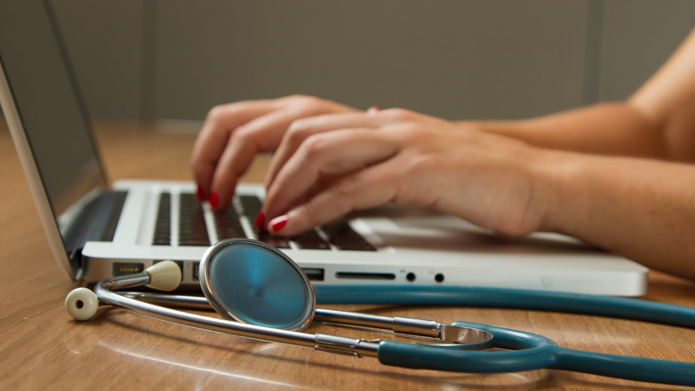 Stethoscope and Laptop Computer. Laptop computers and other kinds of mobile devices and communications technologies are of increasing importance in the delivery of health care. Photographer Daniel Sone.