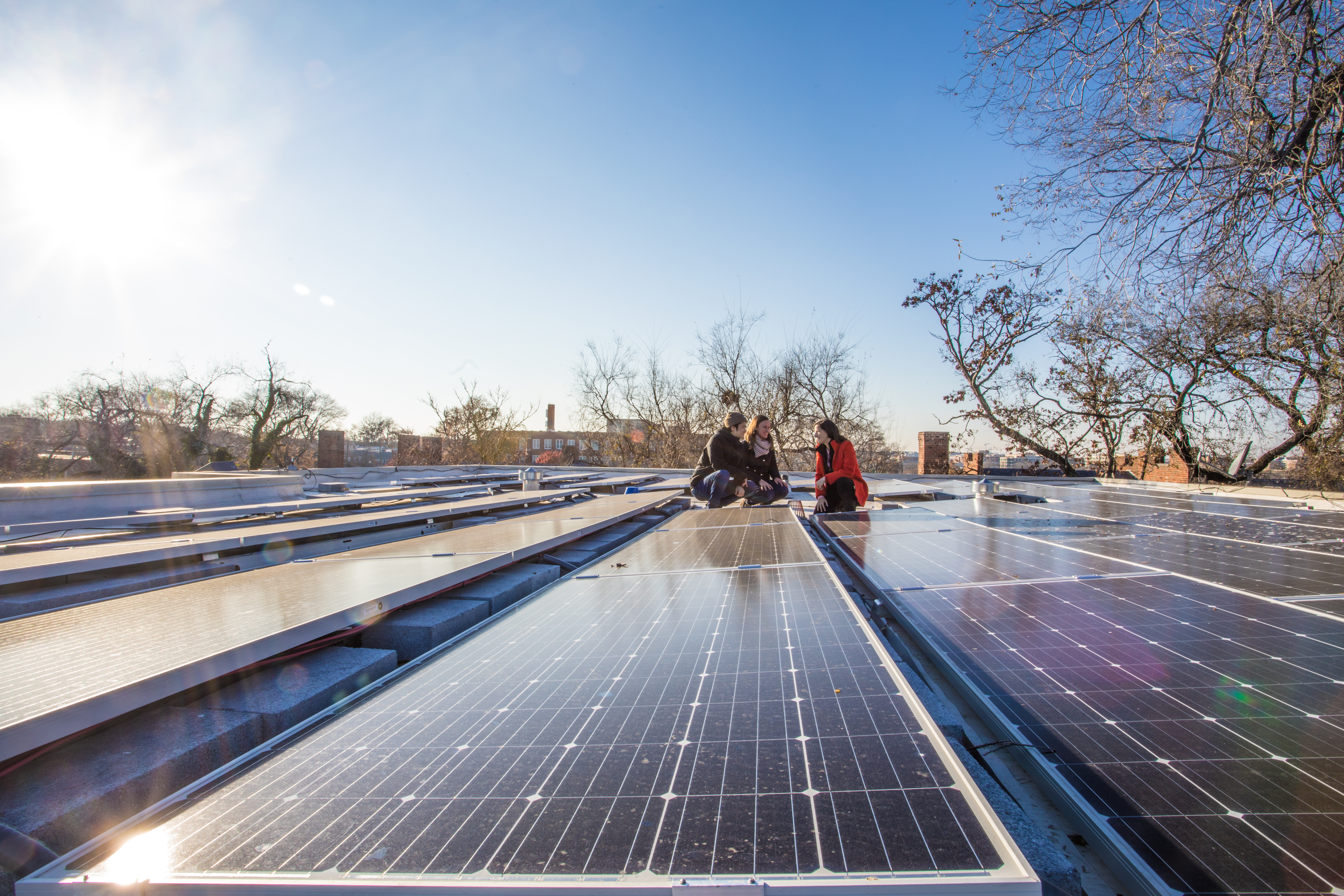 CleanChoice Energy employees at a rooftop solar farm