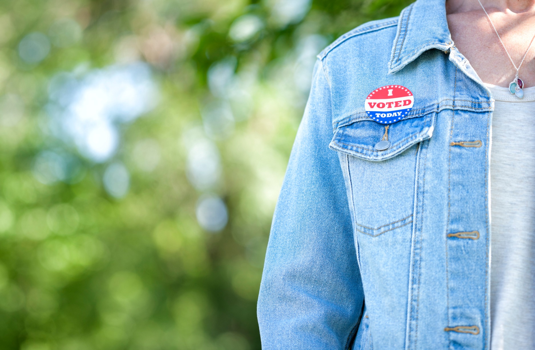 Woman with an 'I Voted' sticker.