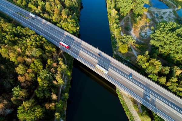 cars on highway crossing over river