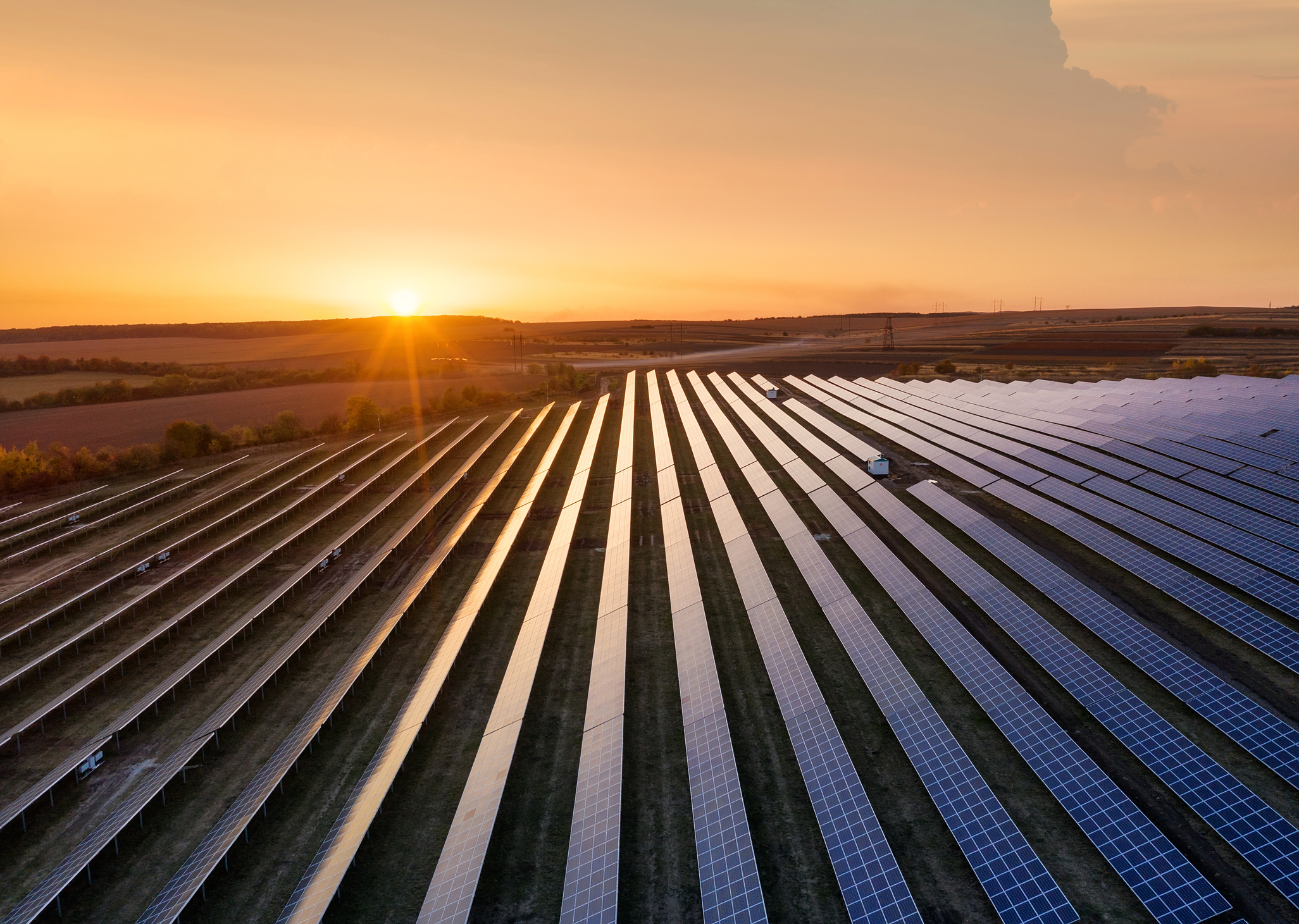 Sun setting over a community solar farm in Maryland