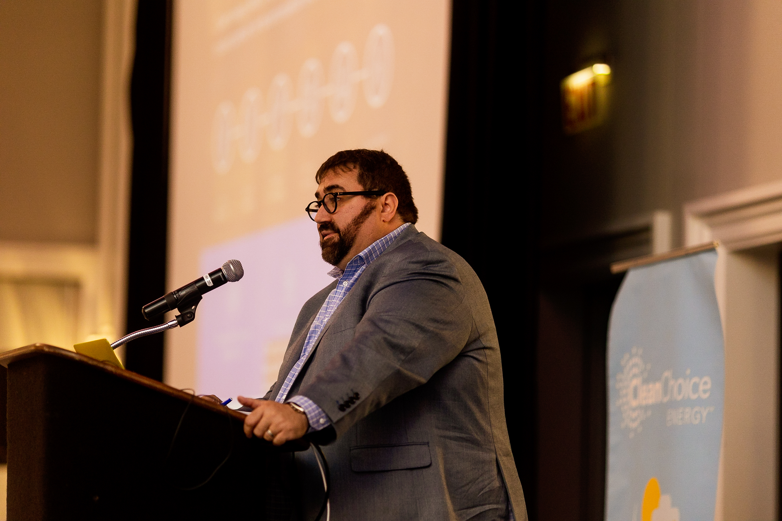 Tom Matzzie, CEO and founder of CleanChoice Energy, speaking at a podium