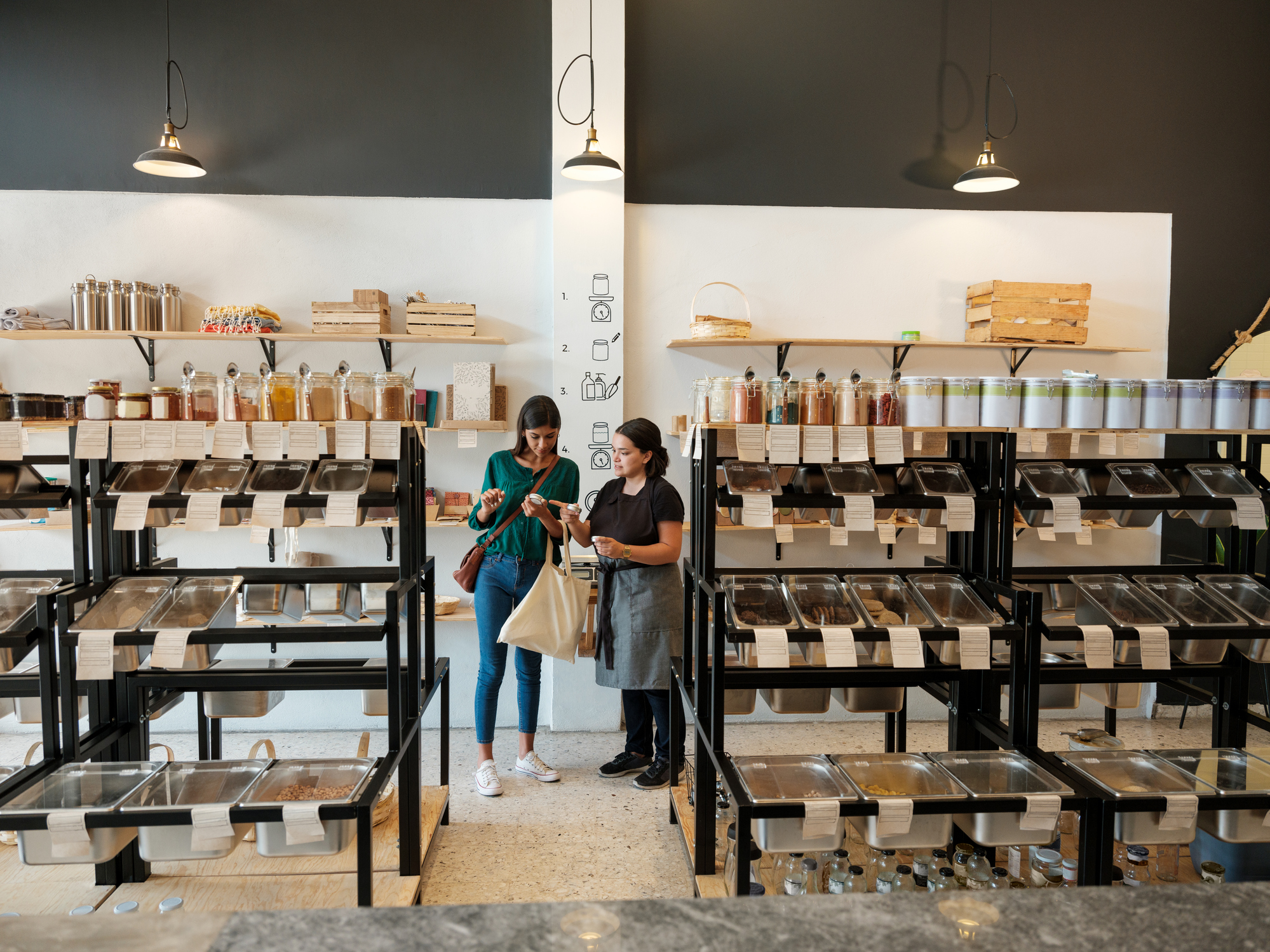 A sustainable shopper shopping in a zero waste store.