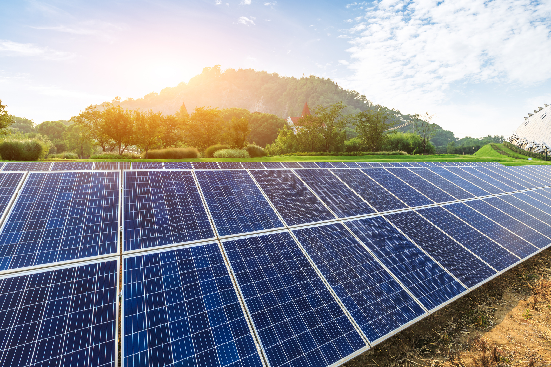 Sun rising over a solar farm